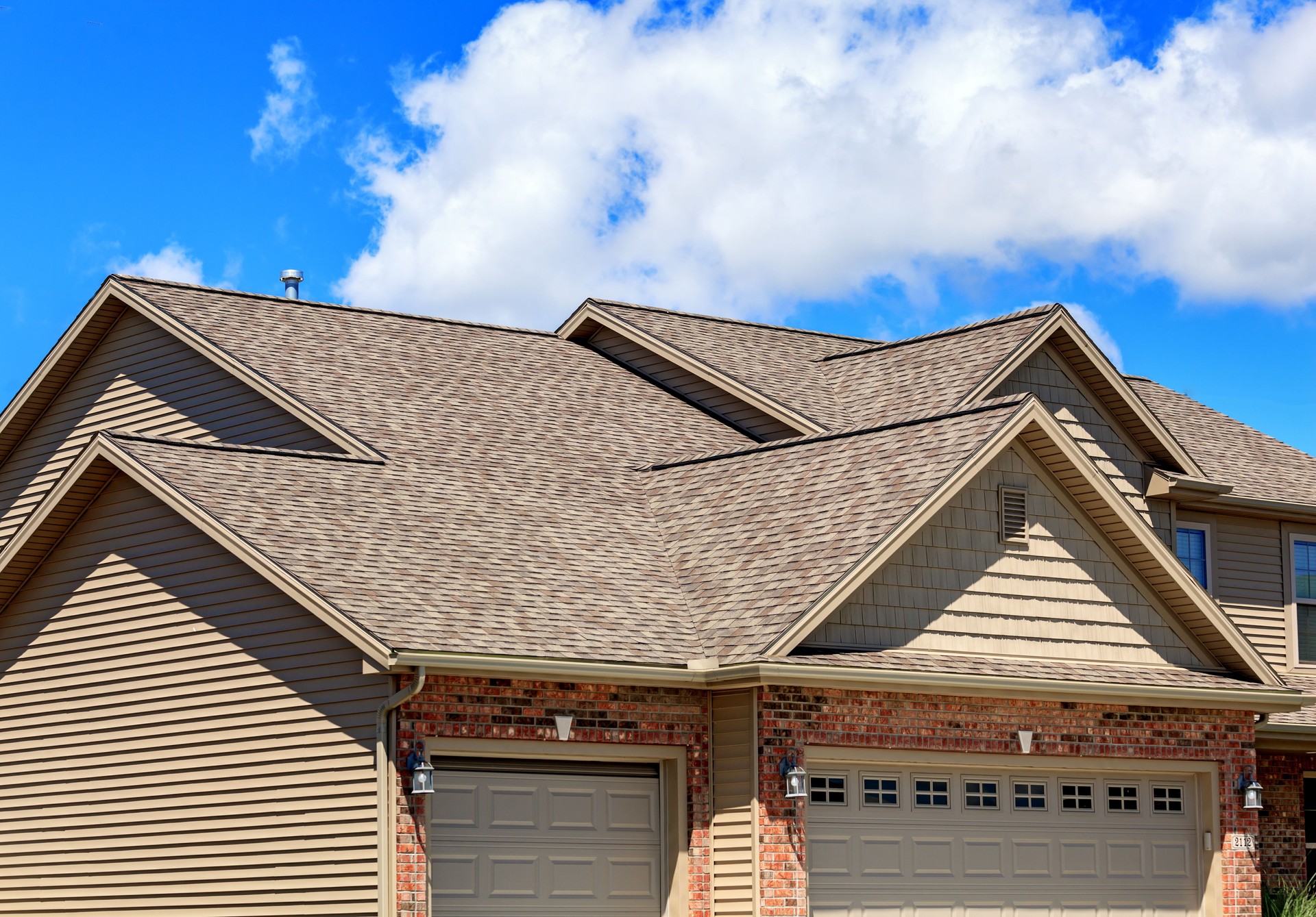 Asphalt roofing shingles on new home